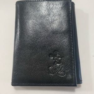 Walt Disney Co. top grain black genuine leather tri fold wallet. NWOT